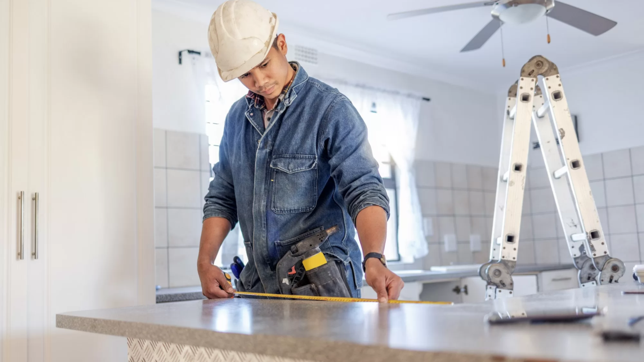 construction-measurement-and-handyman-doing-home-repair-renovation-and-building-a-counter-servic-jpg